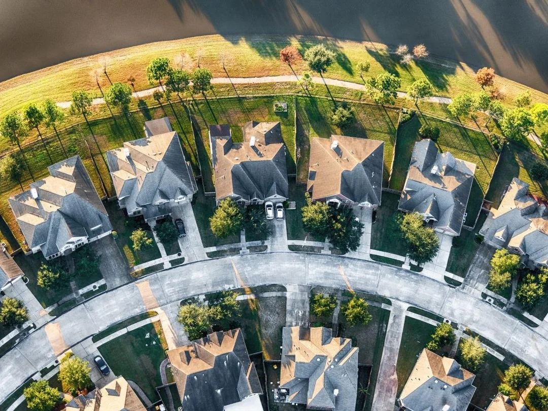 Aerial view row of homes neighborhood street